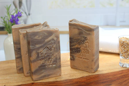 Light brown and soft dark brown colored in an oatmeal, milk and honey scented bar of soap.